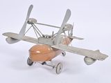 a toy airplane that is sitting on a white surface