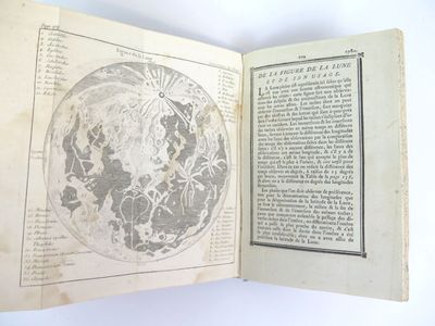 an open book with a map of the world on it