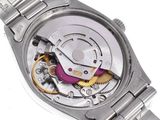 a watch that is on a white surface with a white background