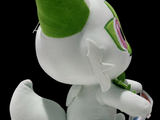 a white stuffed animal with a green hat on it