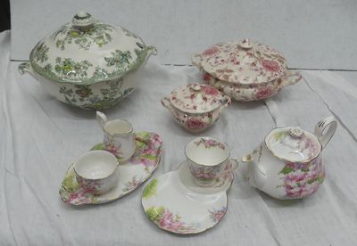 a table with a tea set and a tea pot on it