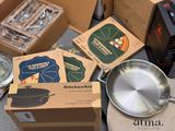 several boxes of kitchen aid items are sitting on a table