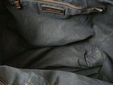 the inside of a purse with a zipper on the inside