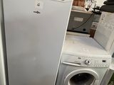 two refrigerators and a washing machine in a store