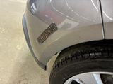 a close up of a car ' s tire with a sticker on it