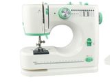 une machine à coudre blanche avec une poignée verte sur fond blanc