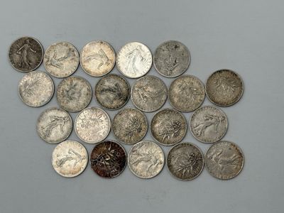 Réunion de 21 pièces en argent de 50 centimes type Semeuse.