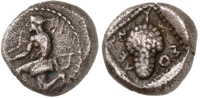 a silver coin with an image of a lion on it