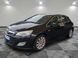 the black opel is parked on a checkered tile floor