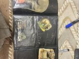 a lot of items that are on the floor next to a cell phone