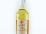 a bottle of alcohol sitting on top of a white surface