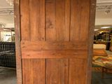 an old wooden door in the middle of a room