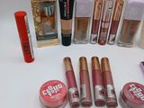 various makeup products are arranged in a circle on a white surface