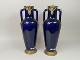 pair of blue vases with gold handles on a white background