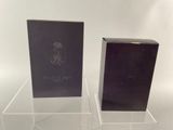 pair of clear acrylic display stands with a black box