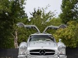 the mercedes 300sl roadster is parked in a parking lot