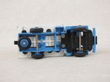 a toy truck that is blue and white with black wheels
