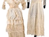 two dresses on a mannequin stand, one in white and the other in beige
