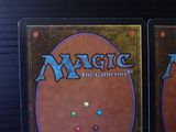two decks of magic the gathering are on display on a table