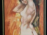 painting of a nude woman in a black frame on a wall