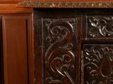 a wooden cabinet with a clock on top of it