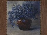 a painting of blue flowers in a vase on a table