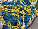 a pile of rope and a pair of scissors on the ground