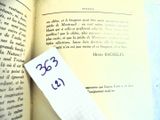 a book with a piece of paper on it with a smiley face drawn on it