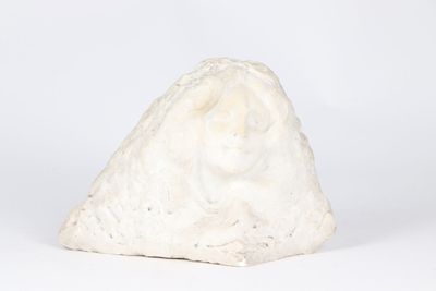 a white rock that is sitting on a white surface