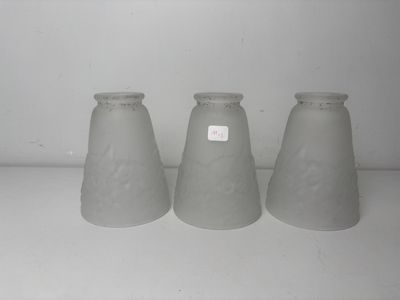 three vases that are sitting on a shelf