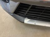 a close up of a car ' s grille and front bumper