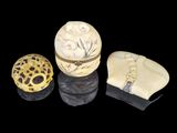 three different types of carved objects are displayed on a black surface