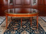 an image of a dining room with a table and chairs