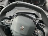 the interior of a car with a steering wheel and dashboard controls