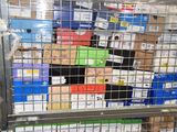 a metal cage filled with boxes and boxes of assorted items