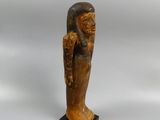 a wooden statue of a woman holding a baby in her arms