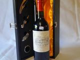 a bottle of wine in a case with a bottle opener