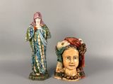 pair of ceramic figurines of a woman and a man