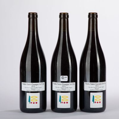 three bottles of wine sitting next to each other on a table