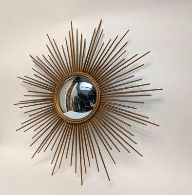 a mirror that is hanging on the wall in the room