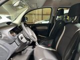 the interior of a small car with two seats and a steering wheel