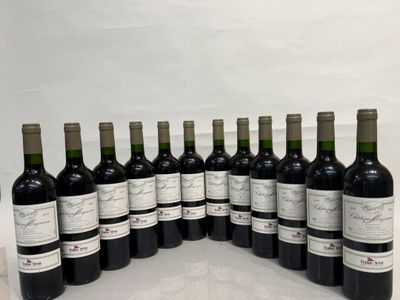 several bottles of wine are lined up in a row on a table