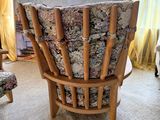 a chair that is sitting in front of a window