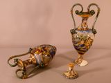 two vases sitting next to each other on a table