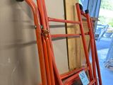 a ladder that is leaning against a wall with a sign on it