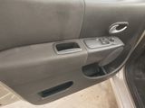 the interior of a car with the door open and the door handle open