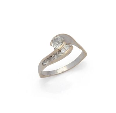 a close up of a diamond ring on a white background