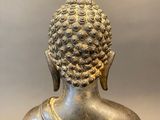a close up of a statue of a person wearing a headdress