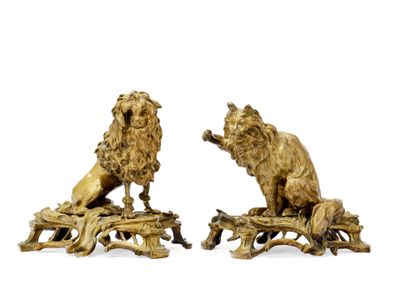 pair of bronze lion figurines on tree stumps