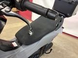 a motor scooter that is parked in a garage